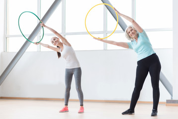 Active sporty women working out using sports equipment