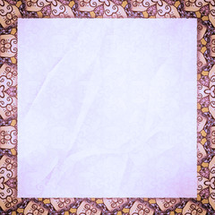 The crumpled form lies on cream-pink wall-paper, with an abstrac