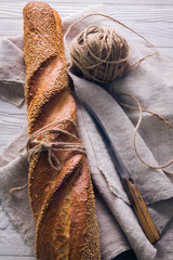 Freshly baked baguette in cloth