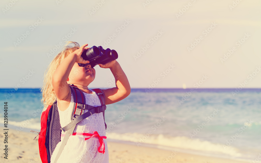 Wall mural little girl travel on beach