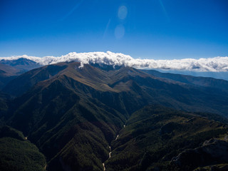Aerial landscape of grand mountain valley with a river.