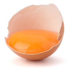 Broken egg  in eggshell half isolated on white background cutout