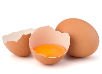 Broken egg in eggshell half and raw egg isolated on white backgr