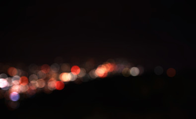Colorful defocused bokeh lights in blur night background