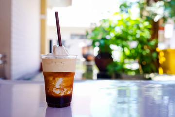 espresso frappe in pet cup with blur background