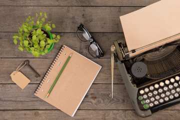 Vintage typewriter on the old wooden desk
