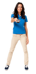 Full-length pretty casual young female woman girl in blue polo shirt using tv electronics remote control isolated on white background