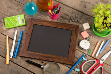 Back to school concept - school supplies on the wooden desk