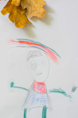 child's drawing of a beautiful girl with a rainbow and oak leaves