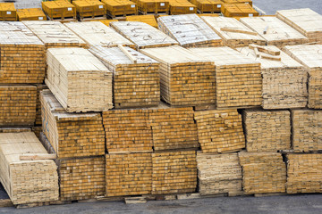 Wooden boards stacked in the port of loading