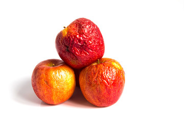 Wizen apple presented as old aging skin