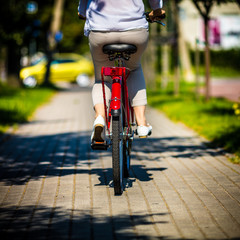 Urban biking - woman riding bike in city