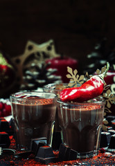 Liquid dark chocolate with spicy chili pepper, Christmas or New