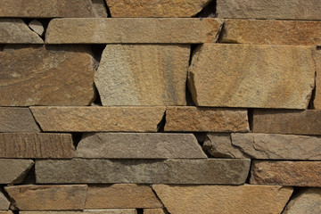 closeup shot of wall made of artificial stones blocks