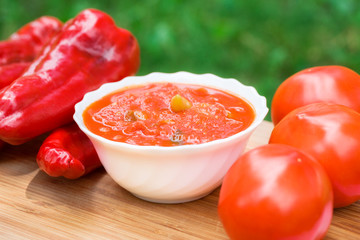Hot peppers in tomato sauce with herbs and garlic
