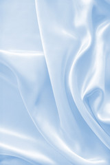 Smooth elegant blue silk or satin as background
