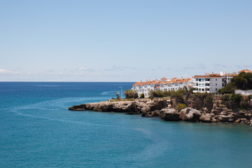 Fototapeta na wymiar White nice hotel on the cliffs next to the sea, Spain