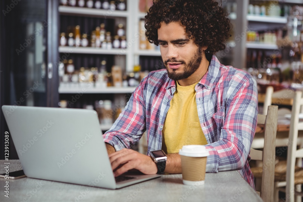 Poster man using laptop