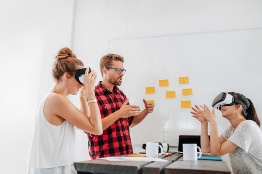 Developers brainstorming on augmented reality technology devices