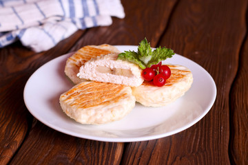 cottage cheese pancakes with mint and banana on a white plate