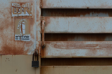 Rusty metal background and fire extinguisher
