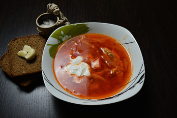 red soup with herbs bread garlic