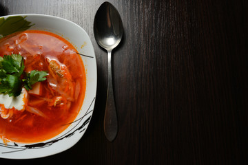 red soup with herbs bread garlic