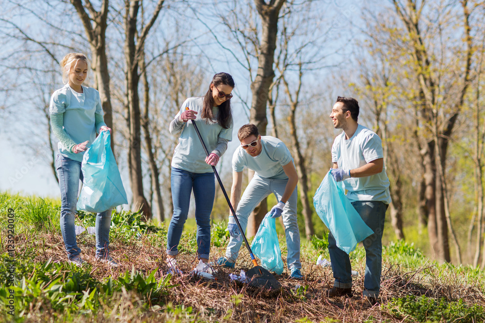 Canvas Prints volunteers with garbage bags cleaning park area