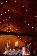 A look from below on the wooden ceiling full of bulbs and greene
