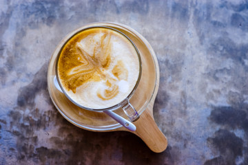 hot coffee with late art on bar