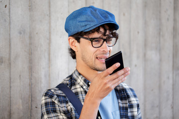 man recording voice or calling on smartphone