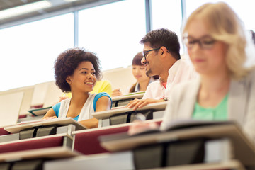 international students talking in lecture hall