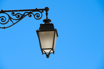 Fototapeta na wymiar Retro vintage street light against blue sky