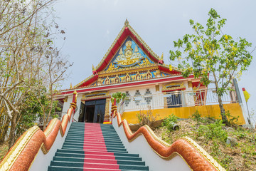 Phuket, Thailand - April 25, 2016 : The main stair leading to the replica of Phra That In-Kwaen (Hanging Golden Rock) at Sirey temple, Phuket, Thailand.