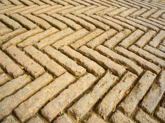 Ancient herringbone pattern brick wall details.