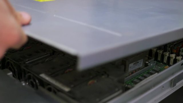 it engineer conducts maintenance work in the server room