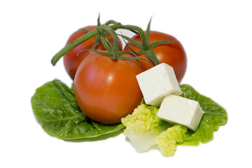 fresh tomatoes ,feta cheese on the salad leaves