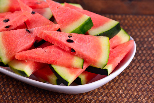 Ripe water melon in the dish on background