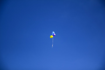 Three balloons in the sky