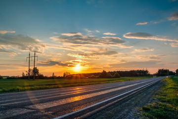 Landscape with orange sunset over highway