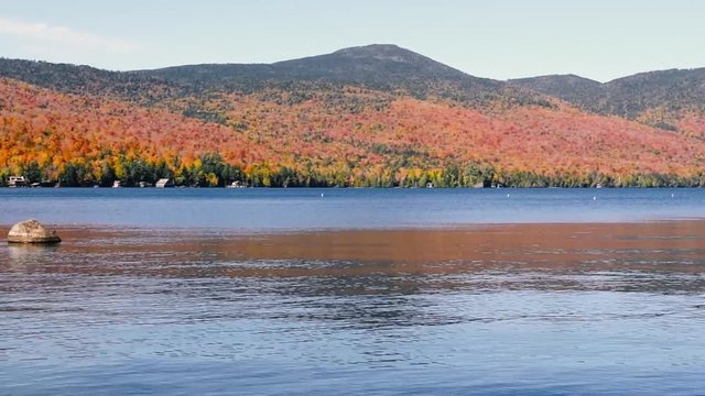 Panoramic view of Lake Placid in the Adirondacks on a bright sunny day with colorful autumn foliage