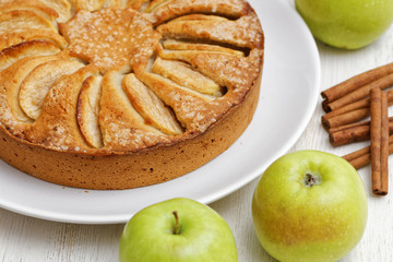 Homemade apple pie on white table