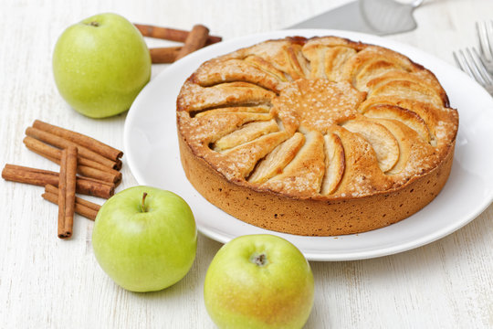 Homemade apple pie on white table