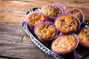 Tasty homemade muffins on silver tray. Top view. Copyspace