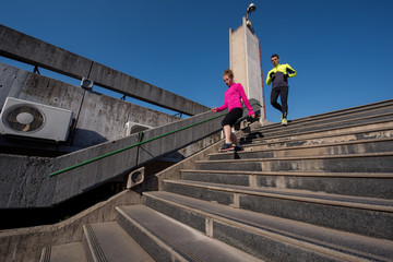 Fototapeta premium young couple jogging on steps