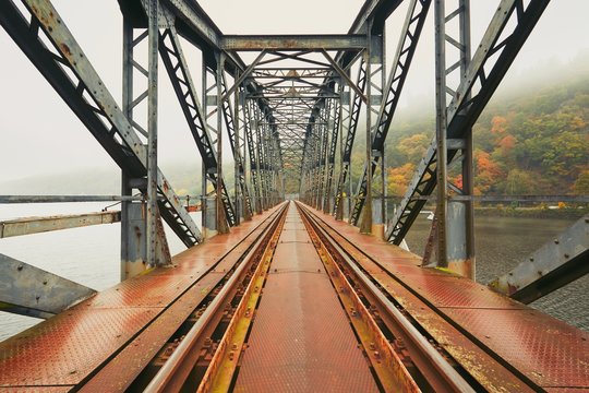 Old railway bridge in foggy morning - Powered by Adobe