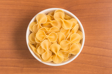 Farfalle into a bowl