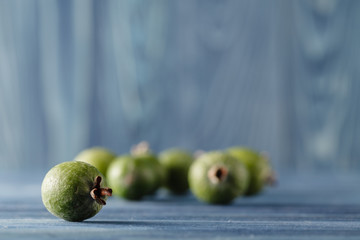 feijoa, pineapple guava on a dark wood background. selective foc