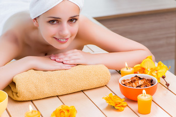 Young woman in spa health concept 