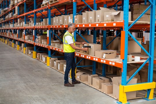 Warehouse worker scanning box